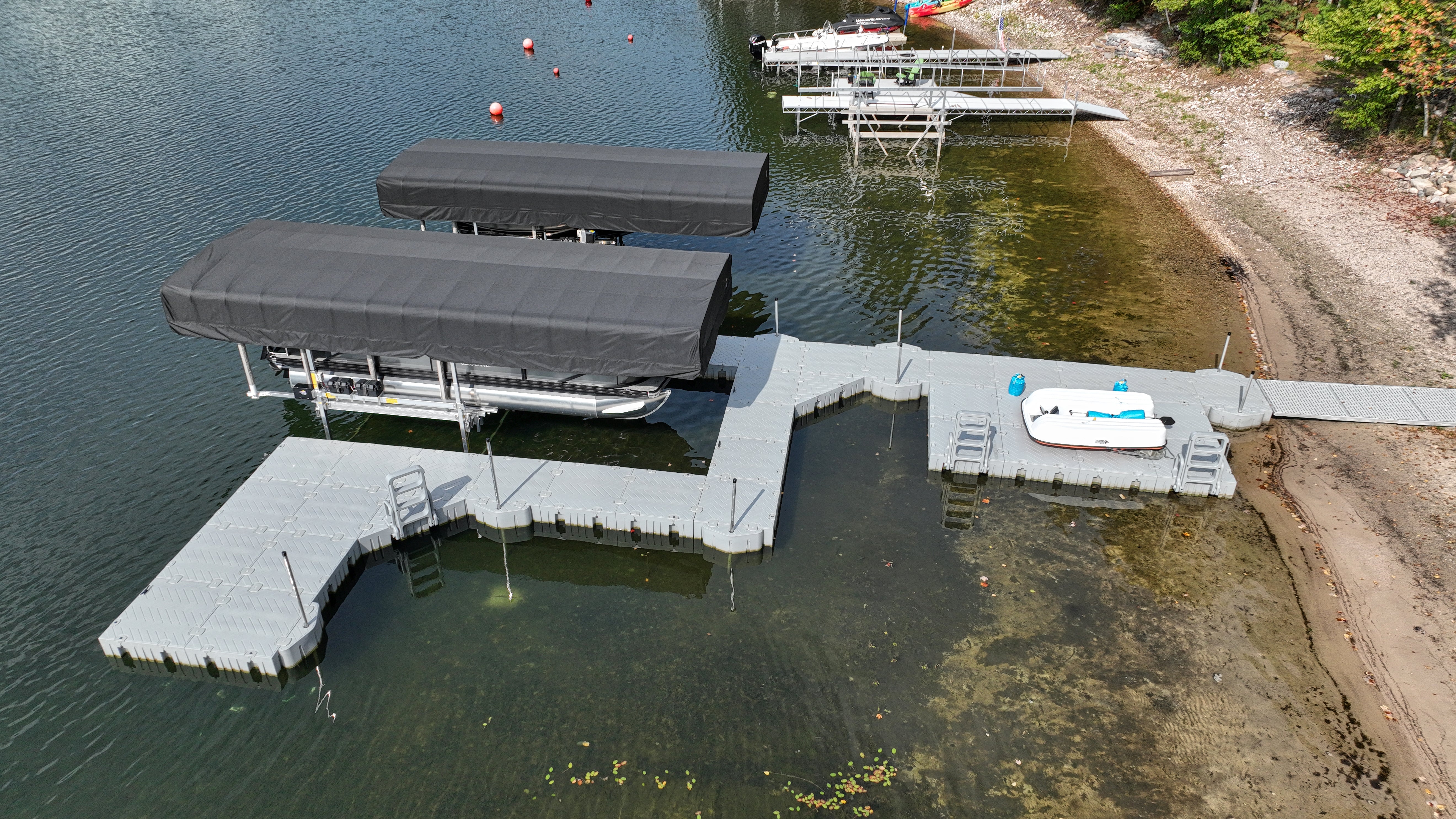 Dock in the water with coverings for boats